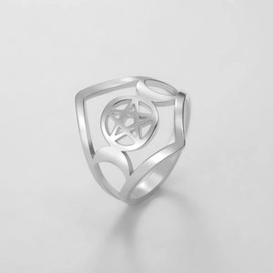 Macro shot of silver stainless steel ring with hollow pentagram and crescent moon design