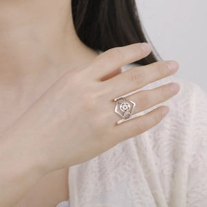 Triple moon pentagram ring in stainless steel worn by a model in a minimalist style