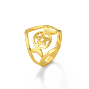 Macro detail of golden triple moon pentagram ring with hollowed out gothic design