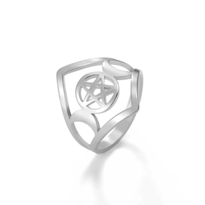 Macro shot of silver stainless steel ring featuring a pentagram and moon design