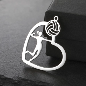 Polished heart-shaped volleyball pendant with female athlete silhouette on black stone