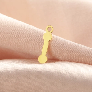 Polished gold dumbbell pendant on silk fabric for DIY jewelry making accessories