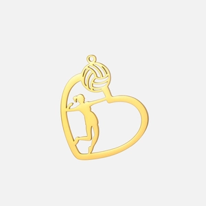 Detailed view of heart-shaped gold volleyball pendant with athlete silhouette cutout