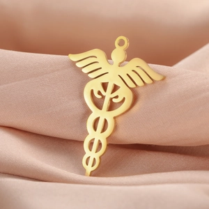 Colgante médico Caduceo de acero inoxidable dorado con alas sobre tela de satén