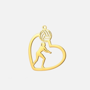 Macro detail of gold plated stainless steel heart pendant with volleyball player silhouette