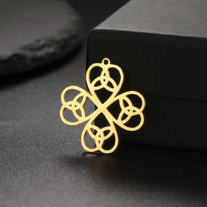 Detail of 18K gold-plated stainless steel Celtic knot clover pendant on jewelry box
