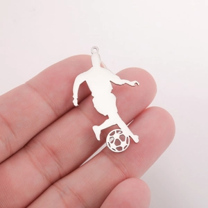 Detailed close-up showing a silver soccer player silhouette pendant with a hollow football