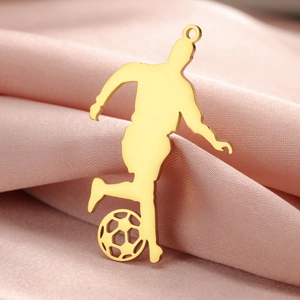 Polished golden soccer player pendant on pink silk background for necklace DIY