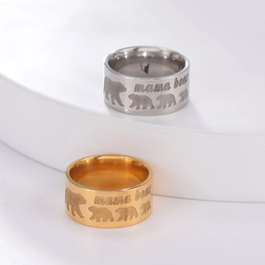 10mm stainless steel mama bear rings in gold and silver finish on display stands