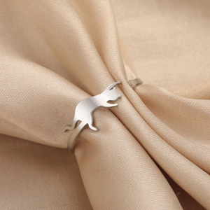 Minimalist stainless steel open ring with a cat silhouette on elegant satin fabric