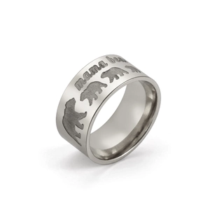 Detail of mama bear engraving and bear silhouettes on 10mm wide stainless steel ring