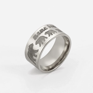 Macro shot of 10mm stainless steel ring showing mama bear engraving and bear patterns