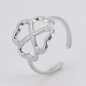 Detailed close-up of silver hollow clover ring with heart-shaped petal design