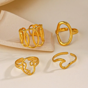 Set of four minimalist gold-plated stainless steel rings with geometric abstract designs