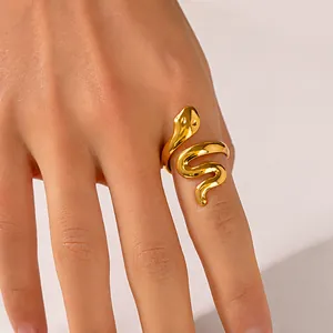 Close-up of 18K gold plated snake-shaped adjustable ring on a woman finger