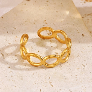 Minimalist hollow oval link ring in gold finish on a natural stone background