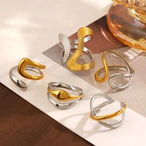 Minimalist two-tone stainless steel rings with geometric wavy and interlocking designs