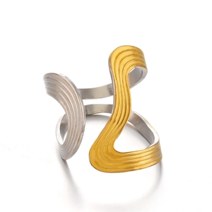 Modern two-tone gold and silver wave ring with curved textures and adjustable open band