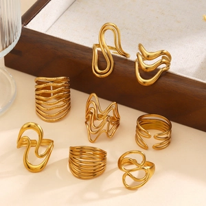 Set of eight 18K gold plated stainless steel wave and geometric rings for women