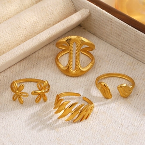 Set of four 18K gold plated stainless steel open rings with flower and leaf designs