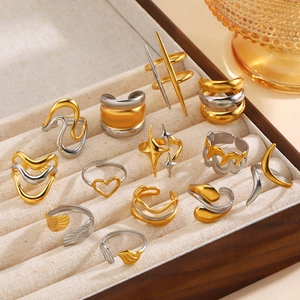 Mix of 18K gold plated stainless steel rings featuring stars and geometric patterns