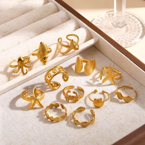 Set of 11 golden stainless steel rings with starfish shell and octopus beach motifs