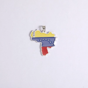 Detail of Venezuela map pendant featuring national flag colors in enamel and steel hook