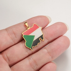 Handheld view of Sudan map pendant featuring flag colors and gold-plated finish