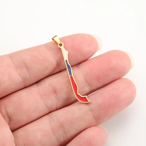 Golden Chile map pendant with red white and blue enamel filling in hand-held view