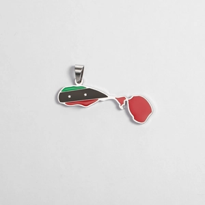 Macro detail of the Saint Kitts and Nevis map pendant with enamel flag colors