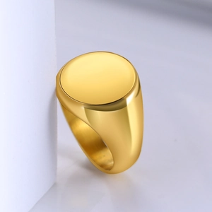 Polished gold stainless steel signet ring for men featuring a high-shine mirror finish surface