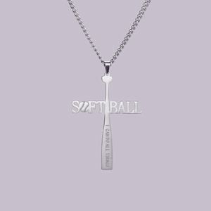 Detailed macro view of silver baseball bat cross pendant with Softball engraving