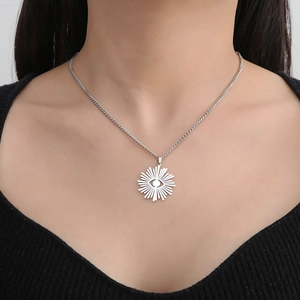 18K gold plated stainless steel sunburst evil eye pendant necklace on female model