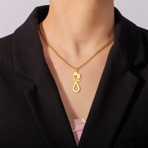 Golden stainless steel necklace featuring infinity embrace pendant worn by a model