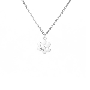 Detail of silver cat paw pendant necklace with custom Japp engraving on polished steel
