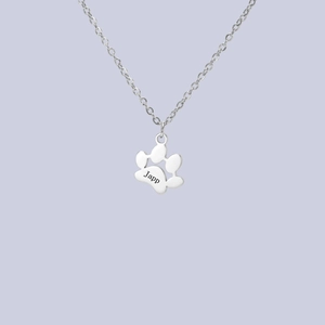 Detailed view of silver stainless steel cat paw pendant with custom Japp engraving