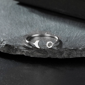 Minimalist adjustable stainless steel ring with crescent moon and circle motifs on stone