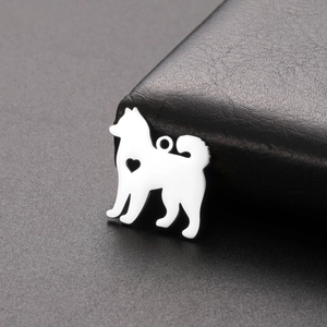 Detailed view of a silver stainless steel Samoyed dog pendant with a hollow heart cutout