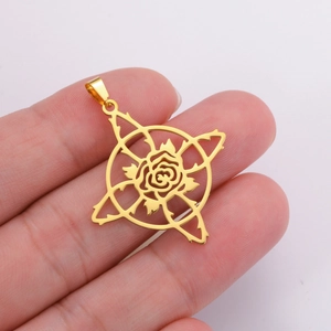 Golden hollow rose pendant with thorn frame and star silhouette on a hand