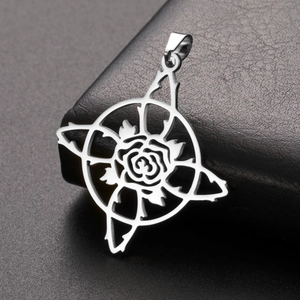 Macro shot of silver stainless steel gothic rose pendant with thorny hollow ring design
