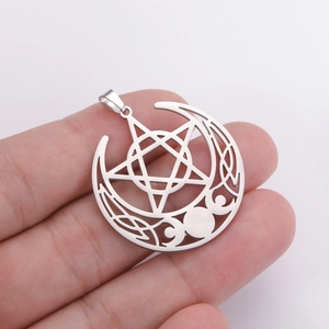 Handheld view of a vintage stainless steel triple moon pentagram pendant with Celtic knots