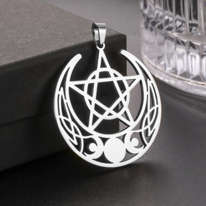 Vintage stainless steel triple moon pentagram pendant with Celtic knot on dark background