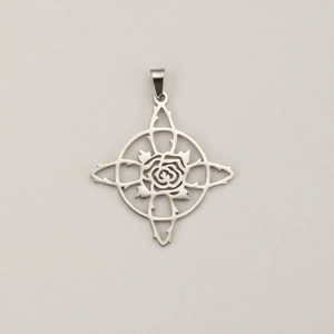 Macro detail of silver stainless steel witch knot pendant with hollow rose star design