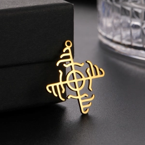 Close-up of gold Vegvisir compass pendant featuring hollow-out Nordic rune design