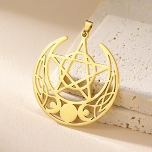 Polished gold stainless steel triple moon pentagram pendant on beige textured stone