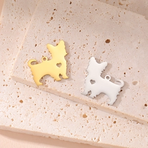 Gold and silver terrier dog pendants with hollow heart design on beige stone base