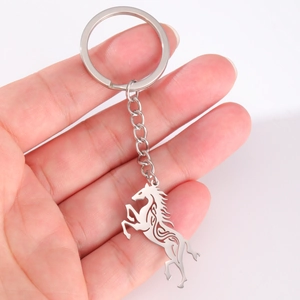 Polished stainless steel keychain with cutout leaping Celtic horse pendant on keyring