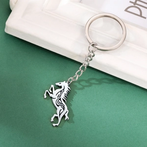 Detailed view of silver Celtic horse pendant keychain with intricate tribal patterns