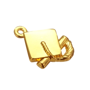 Macro detail of golden graduation cap and scroll alloy charm for DIY jewelry design