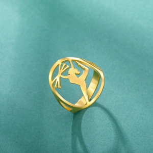 Detailed view of golden stainless steel ring featuring a cutout gymnast silhouette design
